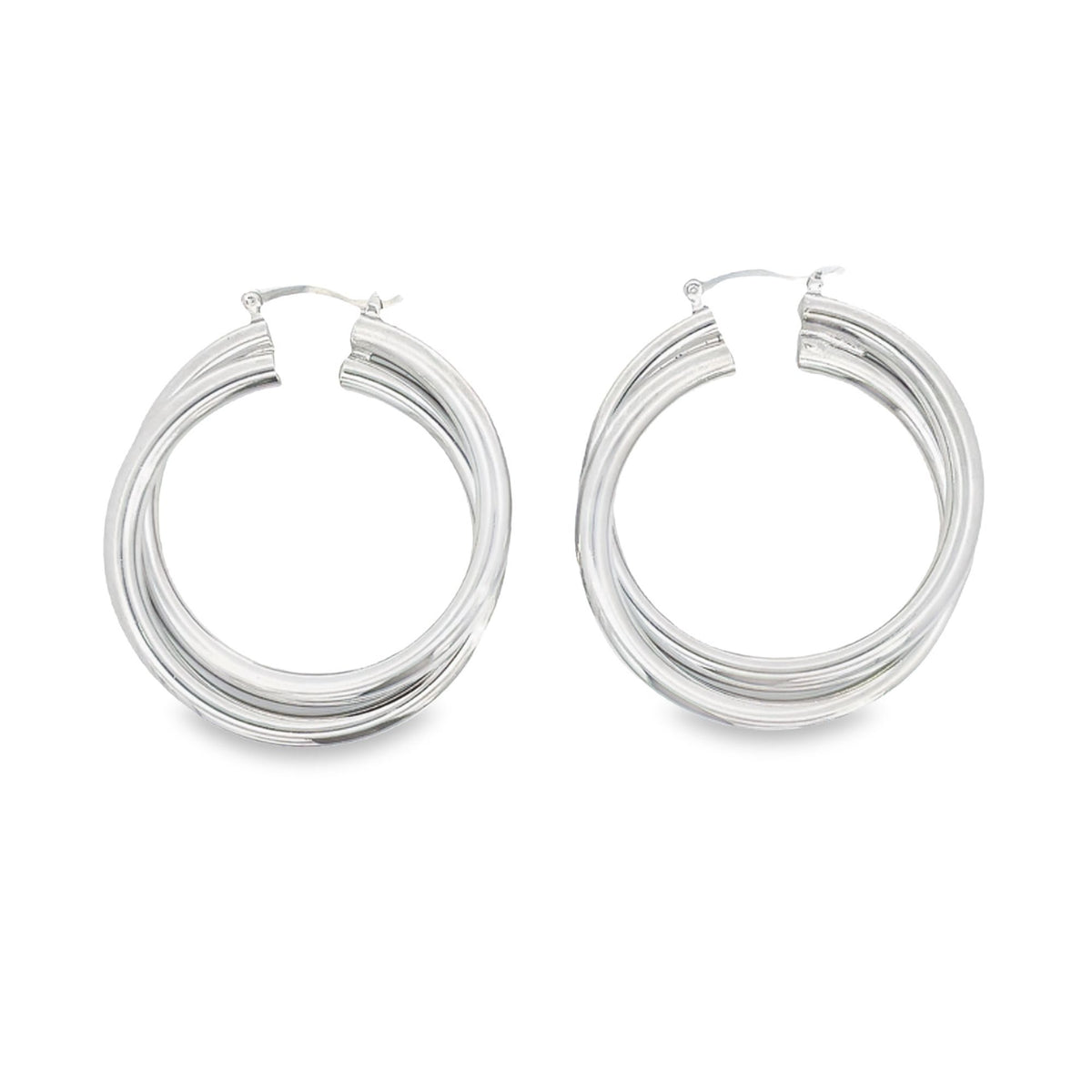 A pair of polished silver triple-hoop earrings rests against a clean white background.