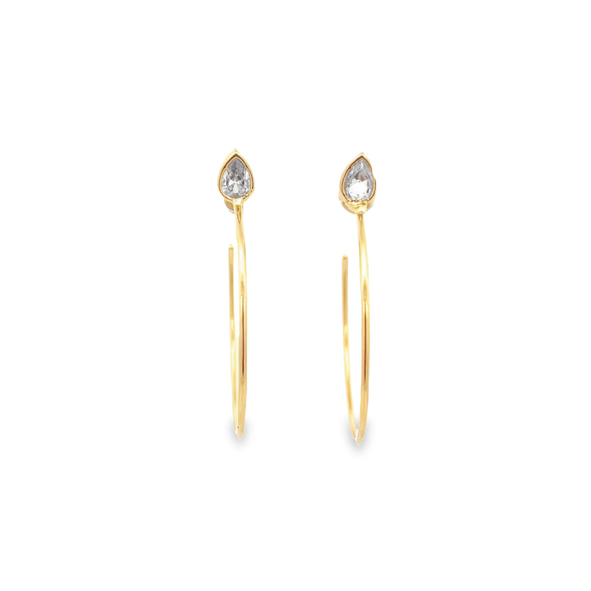 A pair of gold hoop earrings featuring sparkling pear-shaped cubic zirconia stones sparkle against a white background.