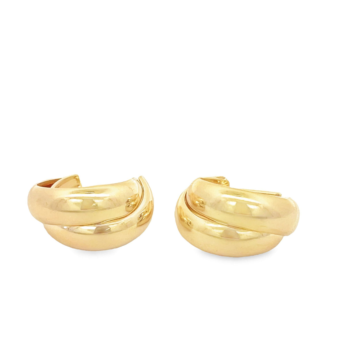 A pair of polished gold chunky double-hoop earrings rests against a clean white background.