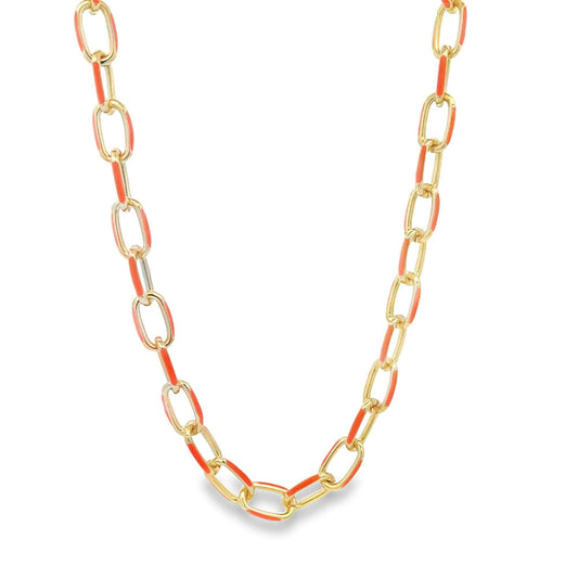 A gold link chain necklace features vibrant orange enamel details on alternate links.