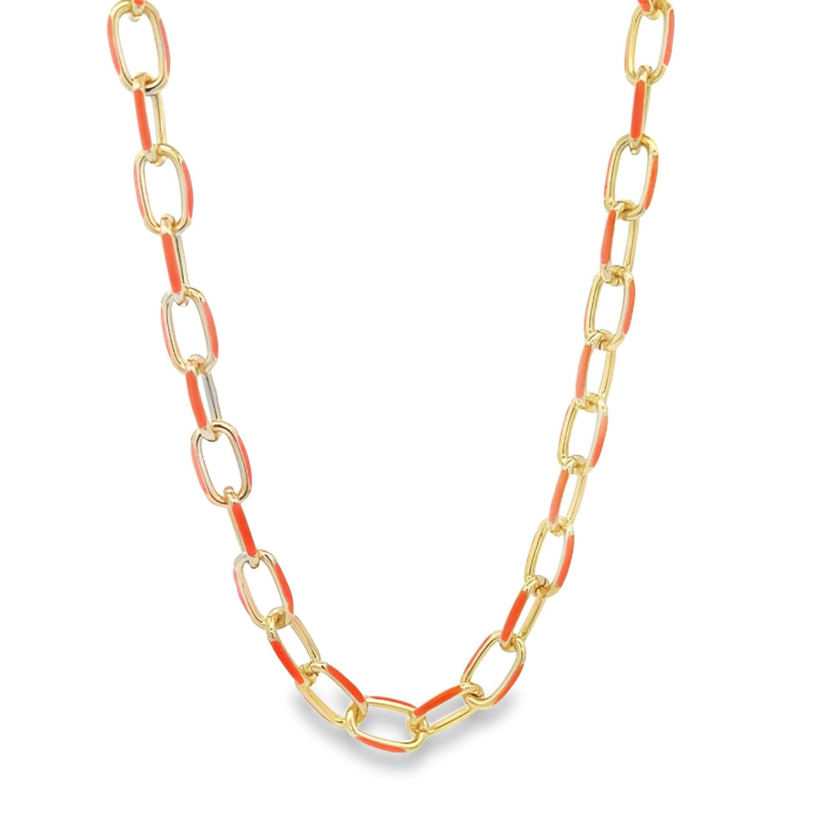 A gold chain necklace features alternating links accented with vibrant orange enamel on a clean white background.
