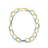 A gold chain link necklace features alternating links accented with vibrant blue enamel against a clean white background.
