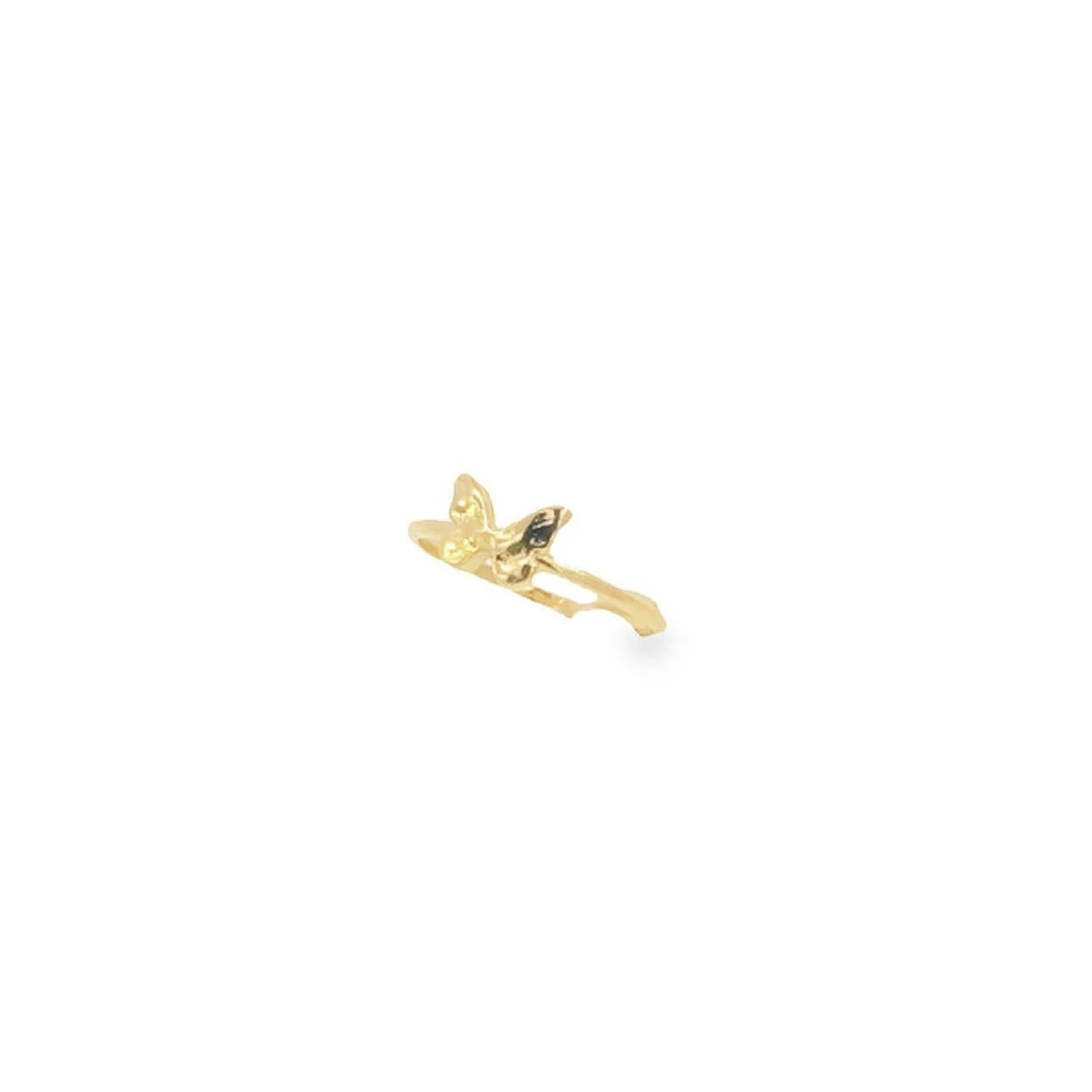 A delicate gold ring features a small, sculpted butterfly resting gracefully on the band against a plain white background.