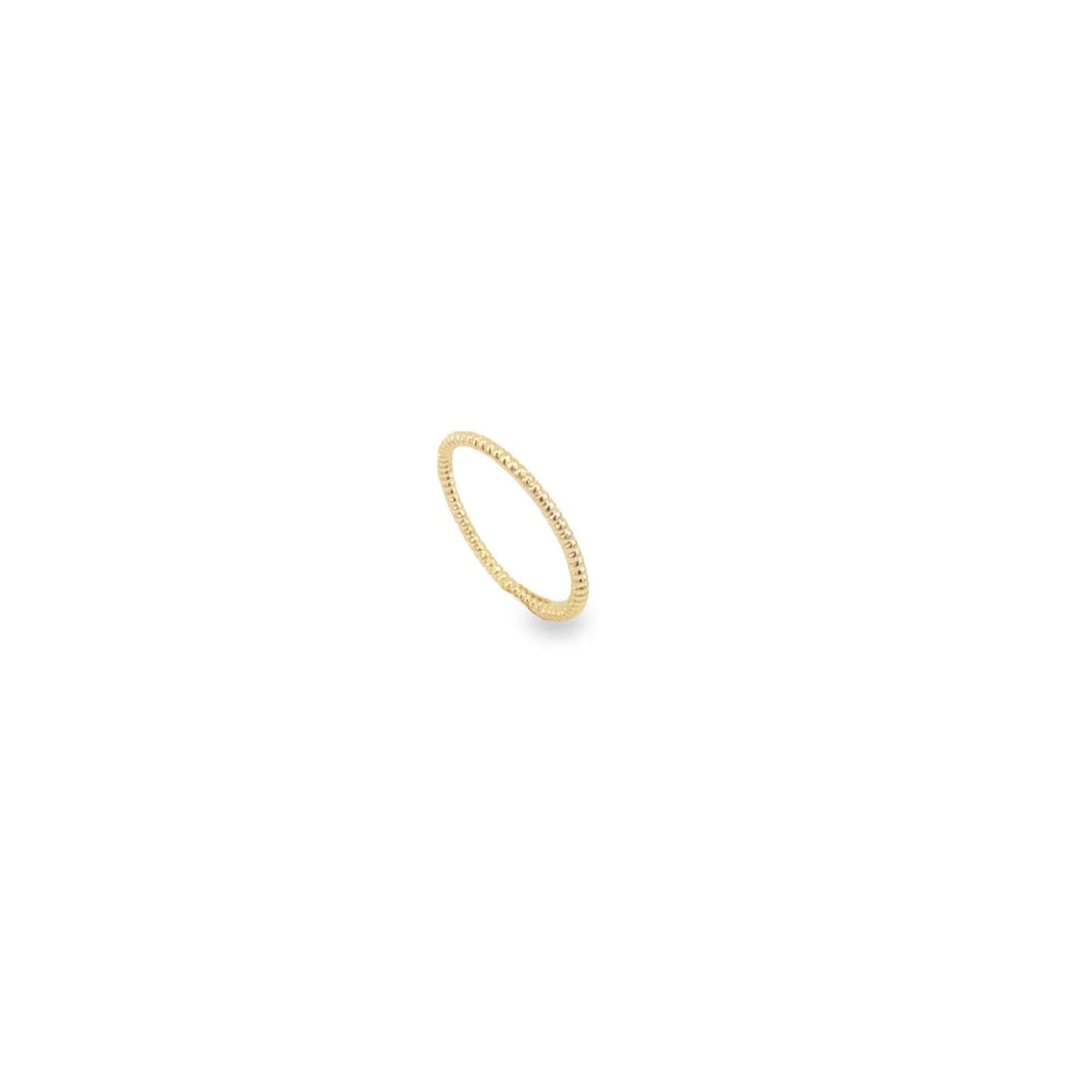 A delicate gold beaded ring rests on a plain white background.