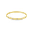 A sleek gold bangle bracelet features evenly spaced square-cut diamonds embedded along its band.