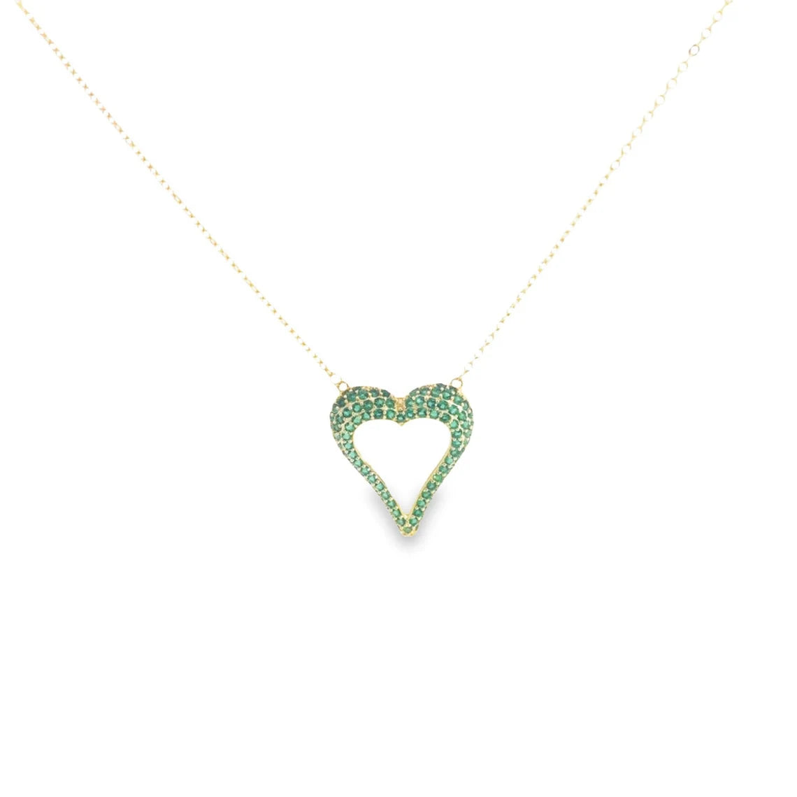 A delicate gold chain holds an open heart pendant encrusted with sparkling green emeralds.