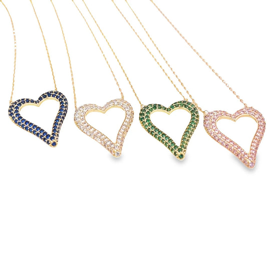 Four delicate gold necklaces feature shimmering heart-shaped pendants encrusted with blue, white, green, and pink crystals.