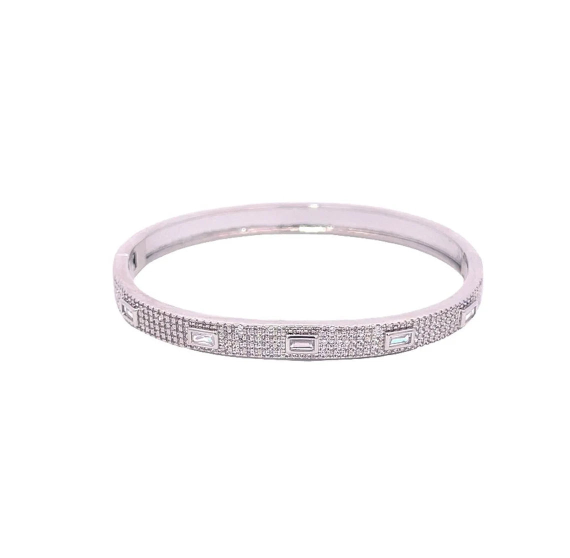 A silver diamond pave bangle bracelet sparkles against a white background, showcasing alternating baguette and round stones.