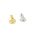 A pair of small, thick gold and silver huggie hoop earrings rests side by side against a clean white background.