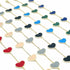 Multiple gold link necklaces with vibrant multicolored enamel heart charms are neatly arranged against a clean white background.