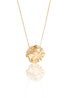 A delicate gold chain necklace hangs against a white background, featuring a glossy, organically shaped gold pendant with a rippled, wavy texture.