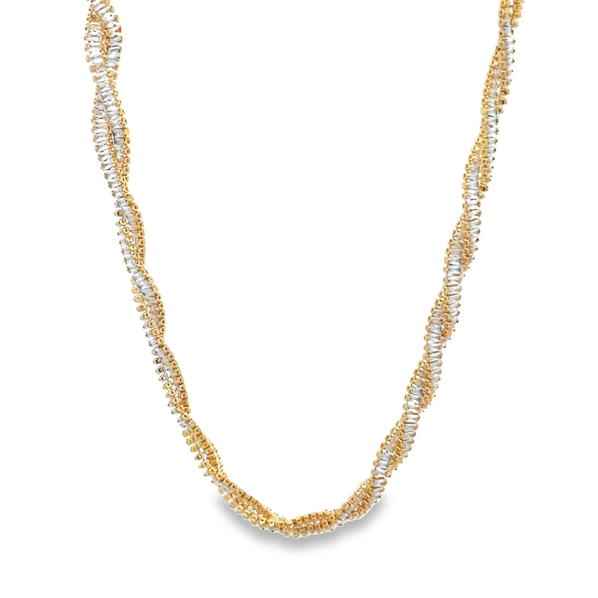 A gold and silver twisted rope necklace rests against a white background.