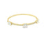 A delicate yellow gold bangle bracelet features three prominent bezel-set diamonds and a pavé of smaller diamonds against a clean white background.