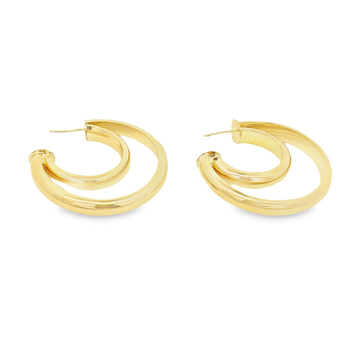 A pair of thick, polished gold double hoop earrings rests against a clean white background.