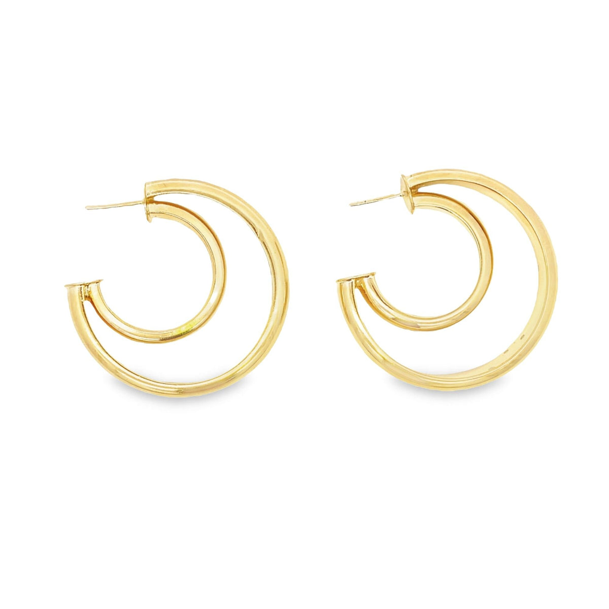 A pair of polished gold double hoop earrings rests against a clean white background.