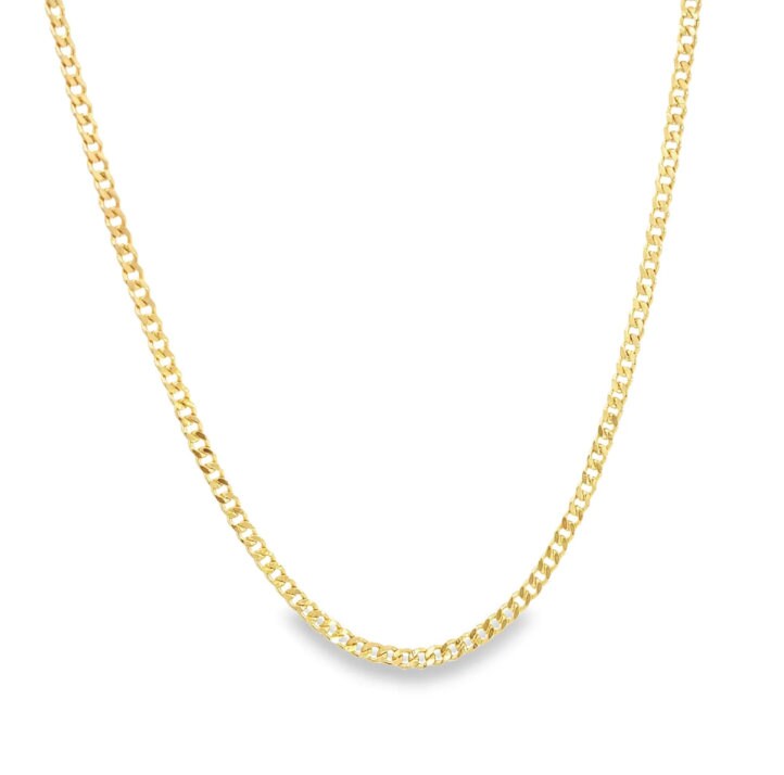 A sleek gold curb chain necklace sparkles against a clean white background.