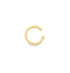 A polished gold nose ring hovers against a clean white background.