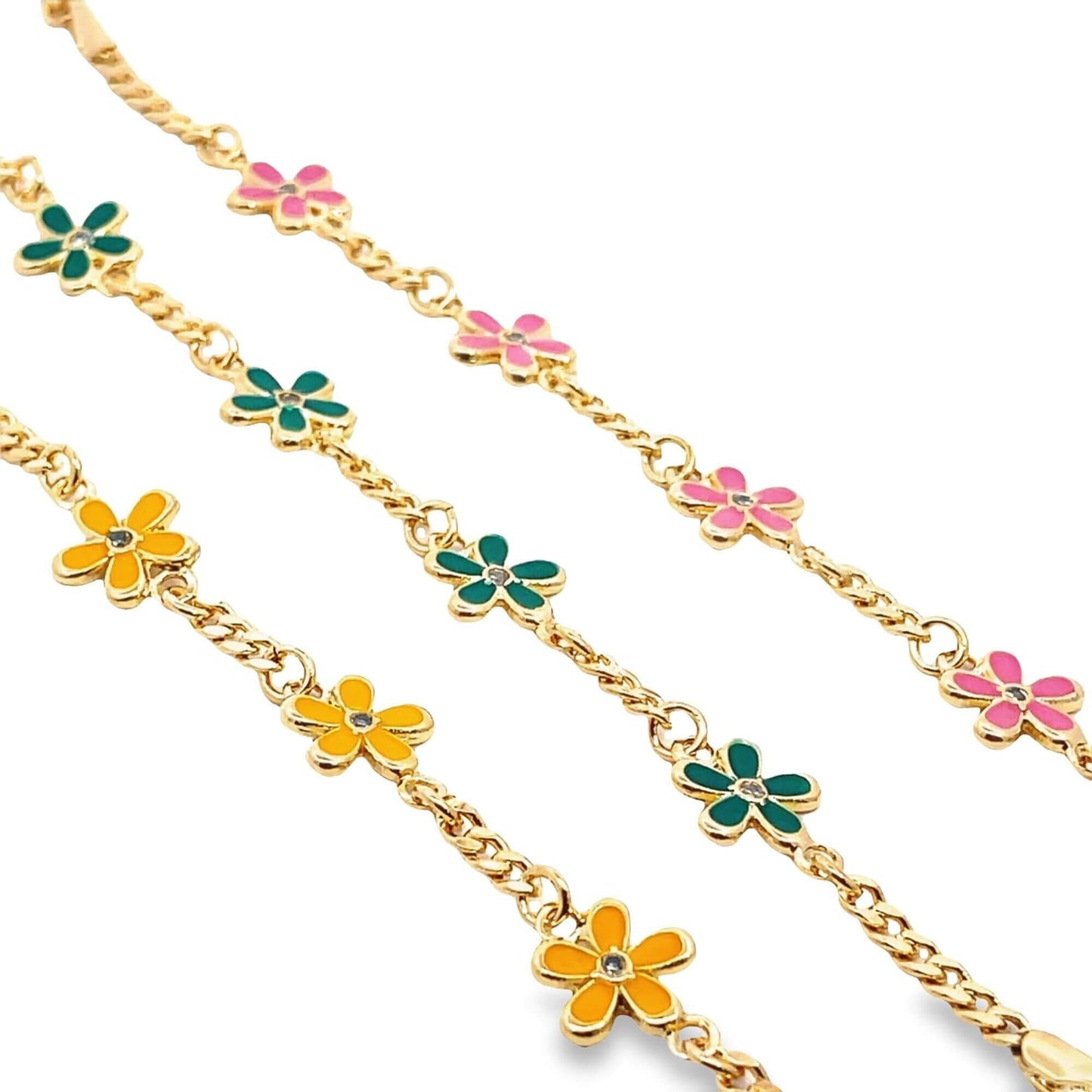 Three gold charm bracelets feature colorful enamel daisy flowers with pink, green, and yellow petals.