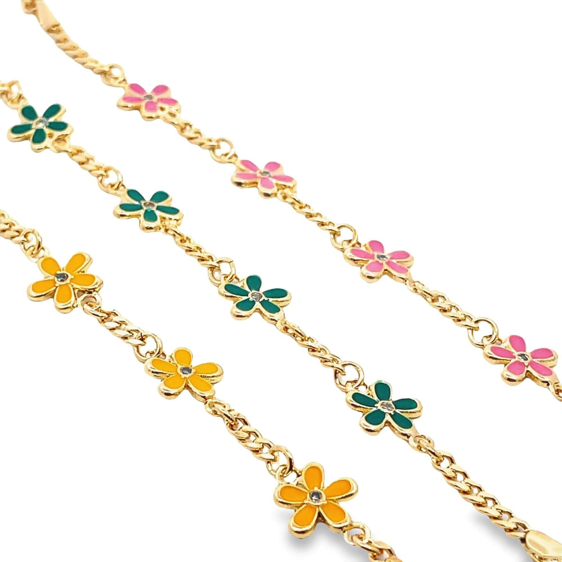 Three gold charm bracelets feature colorful enamel daisy flowers with pink, green, and yellow petals.