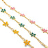 Three gold charm bracelets feature colorful enamel daisy flowers with pink, green, and yellow petals.