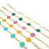 Four delicate gold chain bracelets feature colorful enamel flower charms in white, dark green, pink, yellow, and turquoise against a white background.