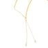 A close-up of a gold adjustable bolo necklace showcases its delicate beaded chain and sliding clasp mechanism against a clean white background.