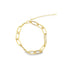 A gold paperclip chain bracelet features a delicate double-strand design against a plain white background.