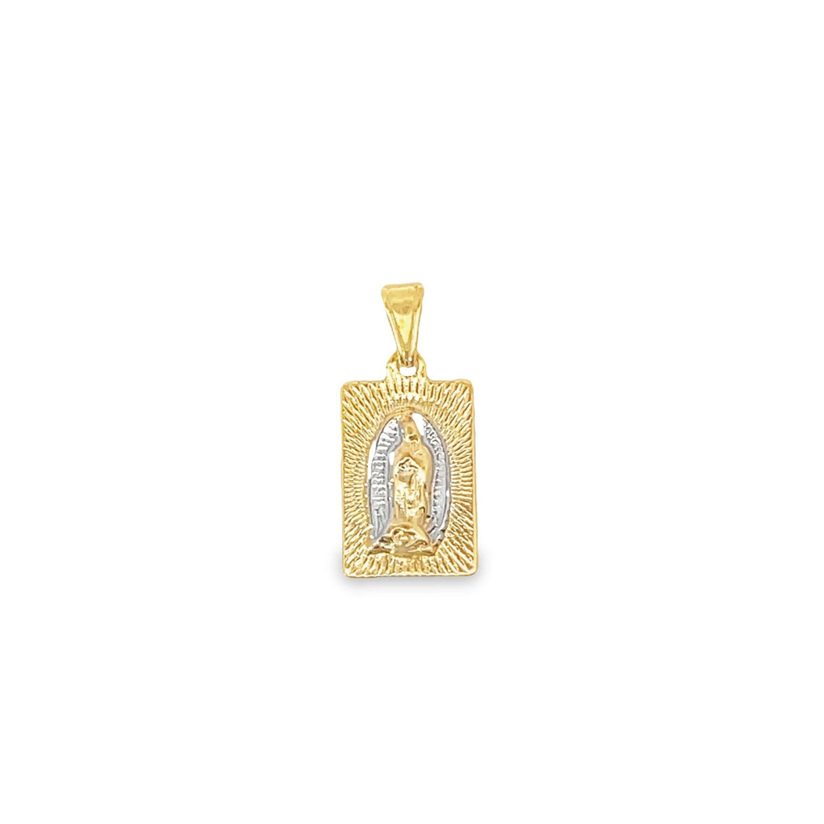A two-tone gold rectangular pendant features a detailed engraving of Our Lady of Guadalupe surrounded by radiating sunburst rays.