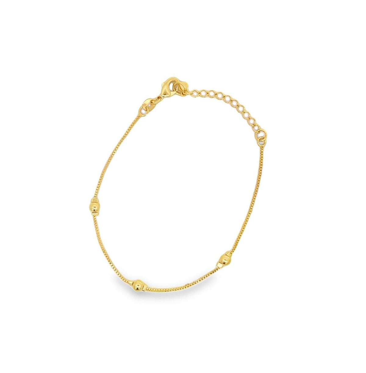 A delicate gold bracelet featuring a thin box chain accented with small round beads and an adjustable extension chain.