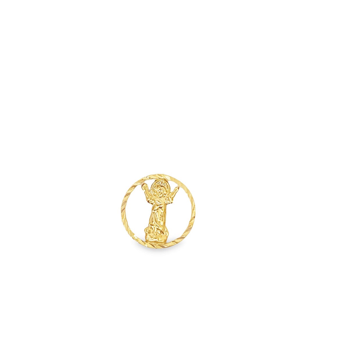 A polished yellow gold medallion features a detailed figure of Santo Niño framed within a textured circular border.