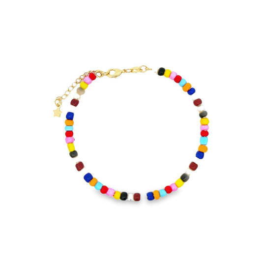 A colorful beaded anklet features a gold chain, lobster clasp, and a small star charm against a white background.