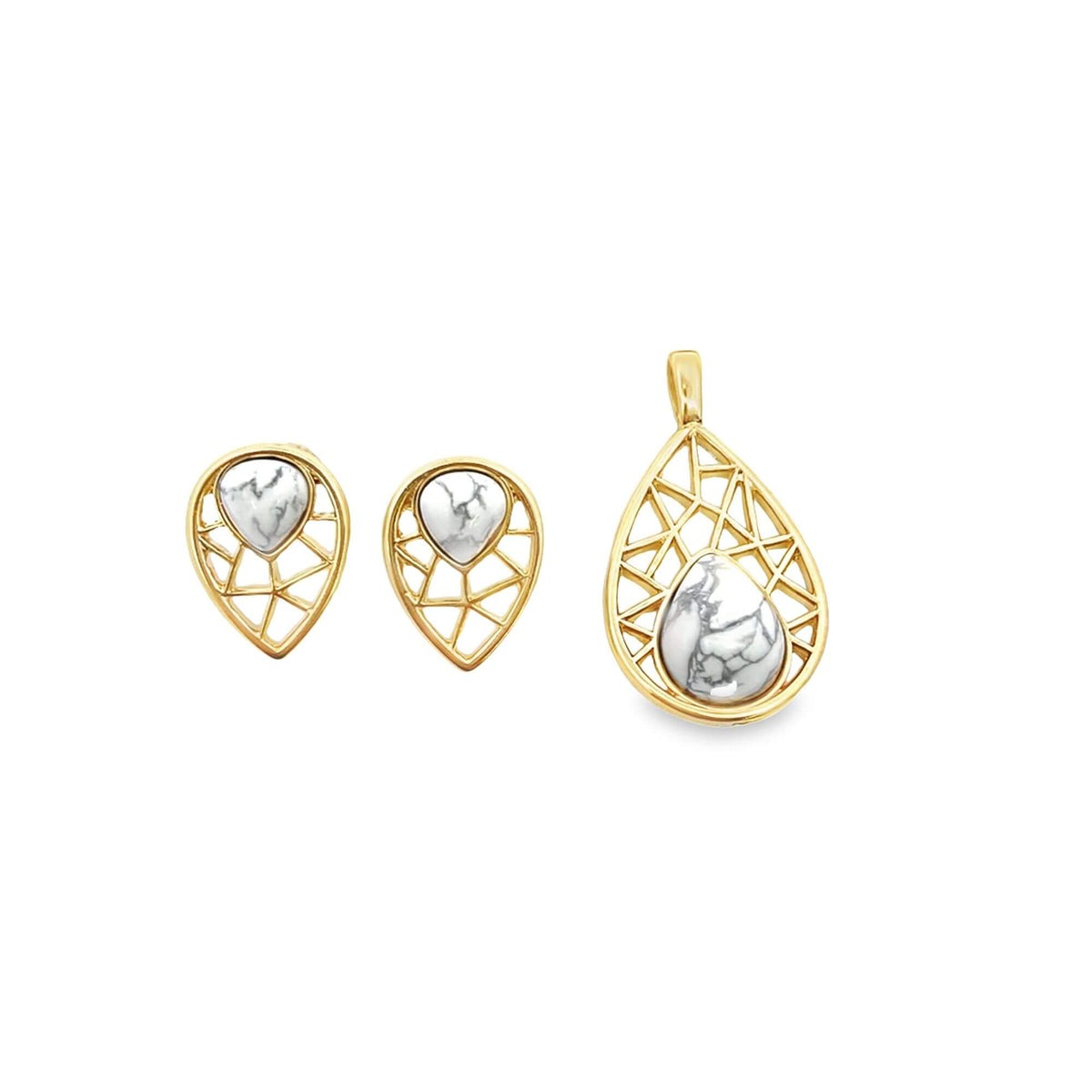 A matching gold jewelry set features teardrop-shaped earrings and a pendant with geometric cutouts framing white marble stones.