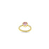 A gold ring features a sparkling pink heart-shaped center stone and diamond accents along the band.