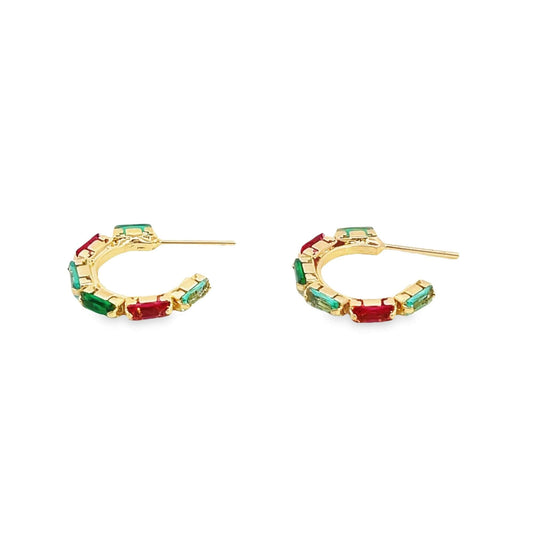A pair of gold hoop earrings features alternating green and red rectangular gemstones against a clean white background.