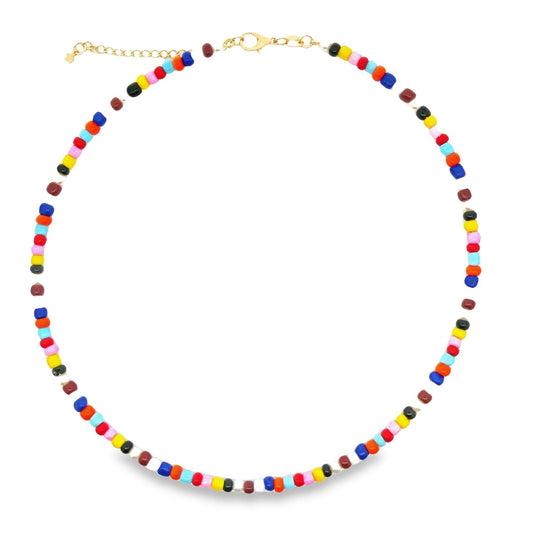 A vibrant beaded choker necklace features a colorful arrangement of small, multi-colored glass beads on a gold chain against a white background.