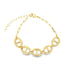 A gold chunky chain link bracelet rests on a clean white background.