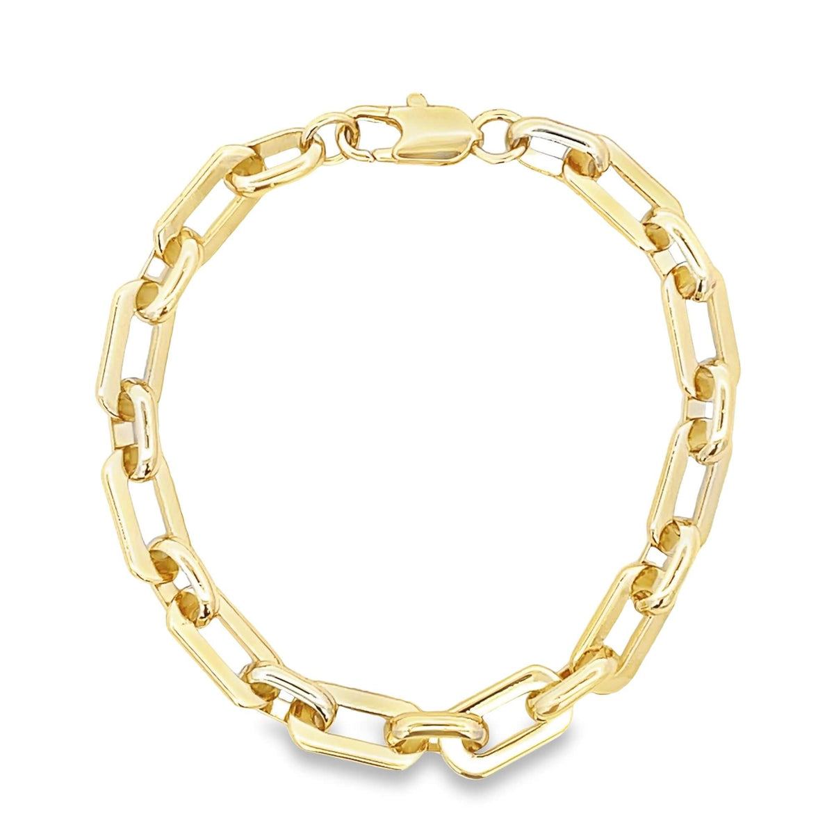 A polished gold paperclip link bracelet rests in a circle against a clean white background.