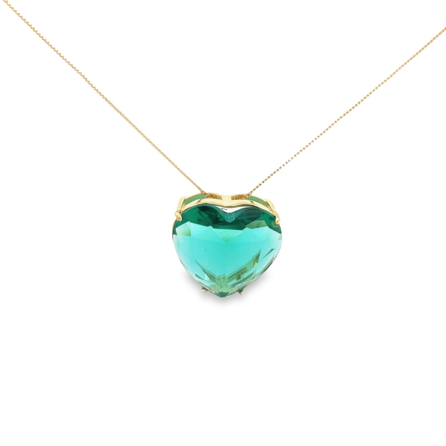 A gold chain necklace displays a large, faceted green heart-shaped crystal pendant against a plain white background.