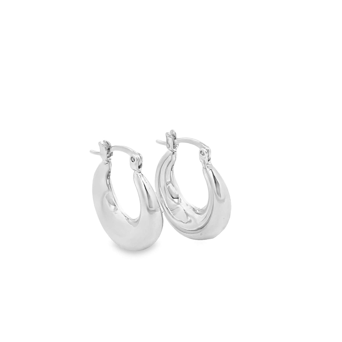A pair of shiny silver hoop earrings rest on a clean white background.