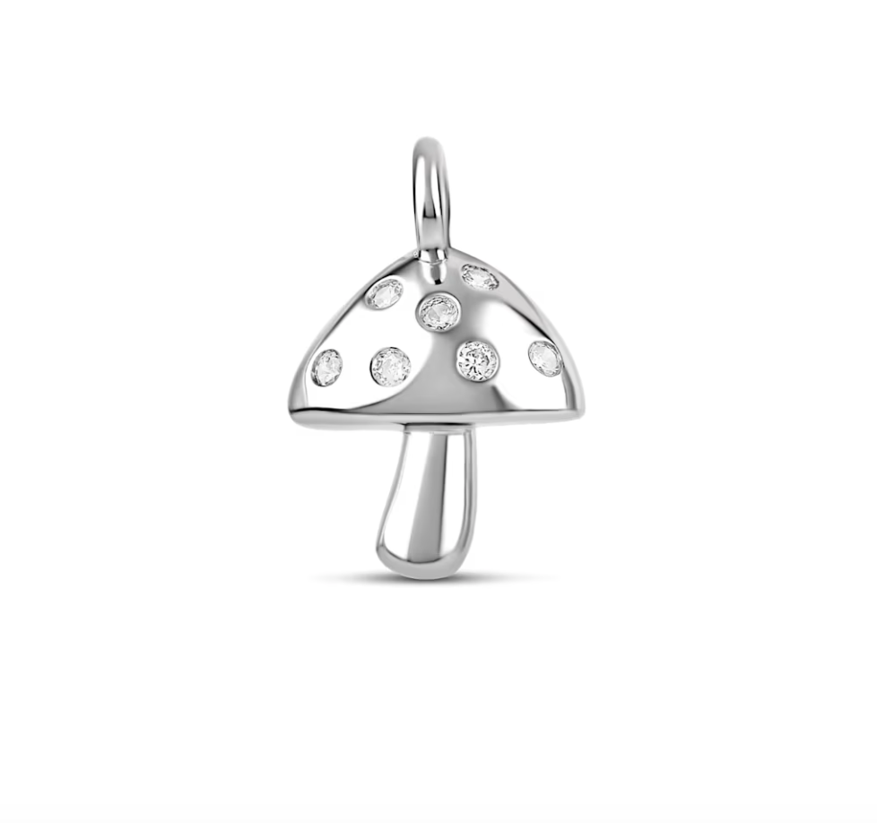 A sterling silver mushroom pendant sparkles with inlaid cubic zirconia crystals across its cap.