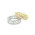 Two interlocking eternity bands featuring sparkling emerald-cut baguette stones in gold and silver rest against a clean white background.