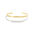 Two minimalist metal cuff bracelets, one gold and one silver, rest stacked on a white surface.