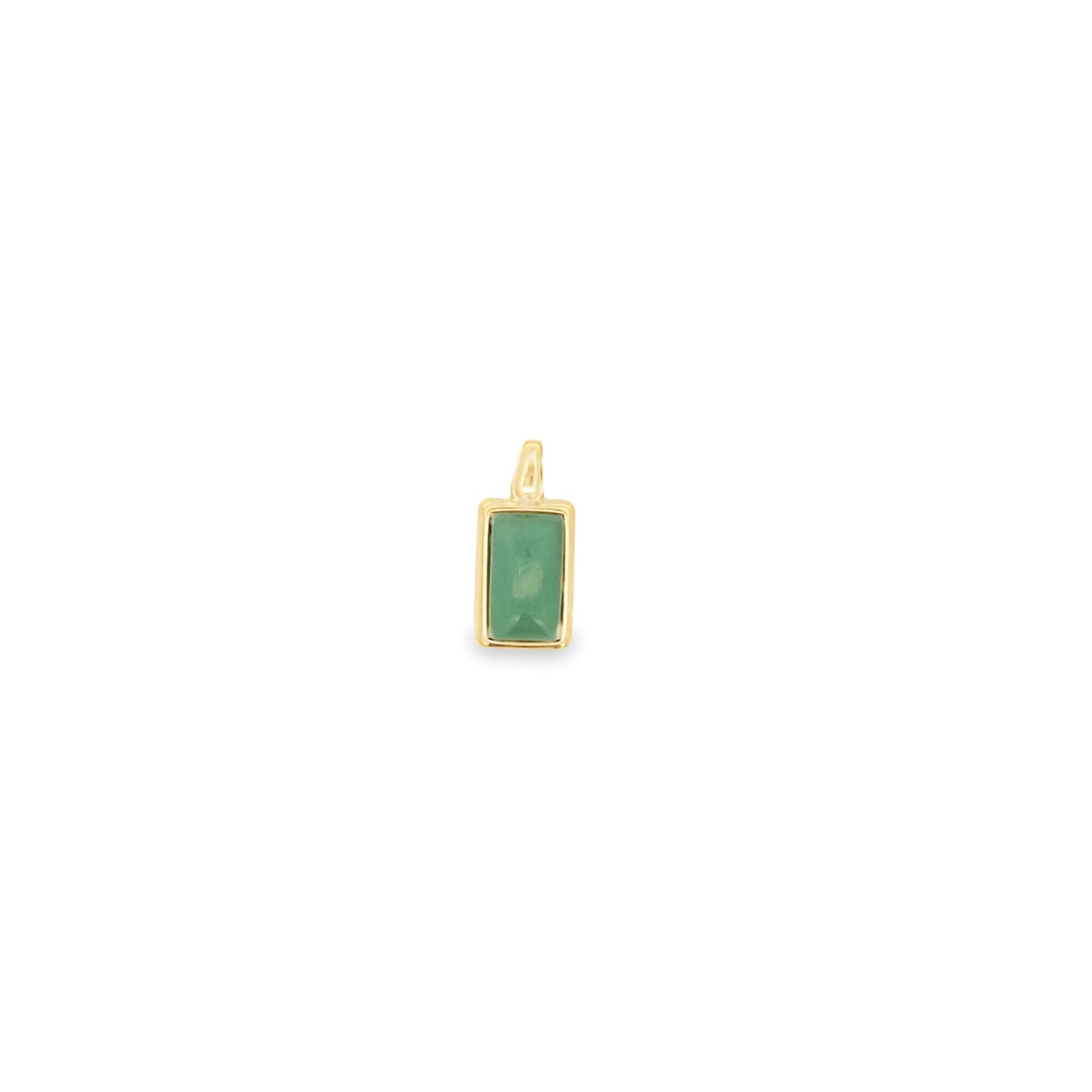 A small gold pendant features a rectangular green gemstone against a plain white background.