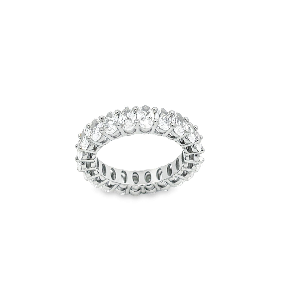 A glittering eternity ring features a continuous band of oval-cut diamonds set in white gold against a clean white background.