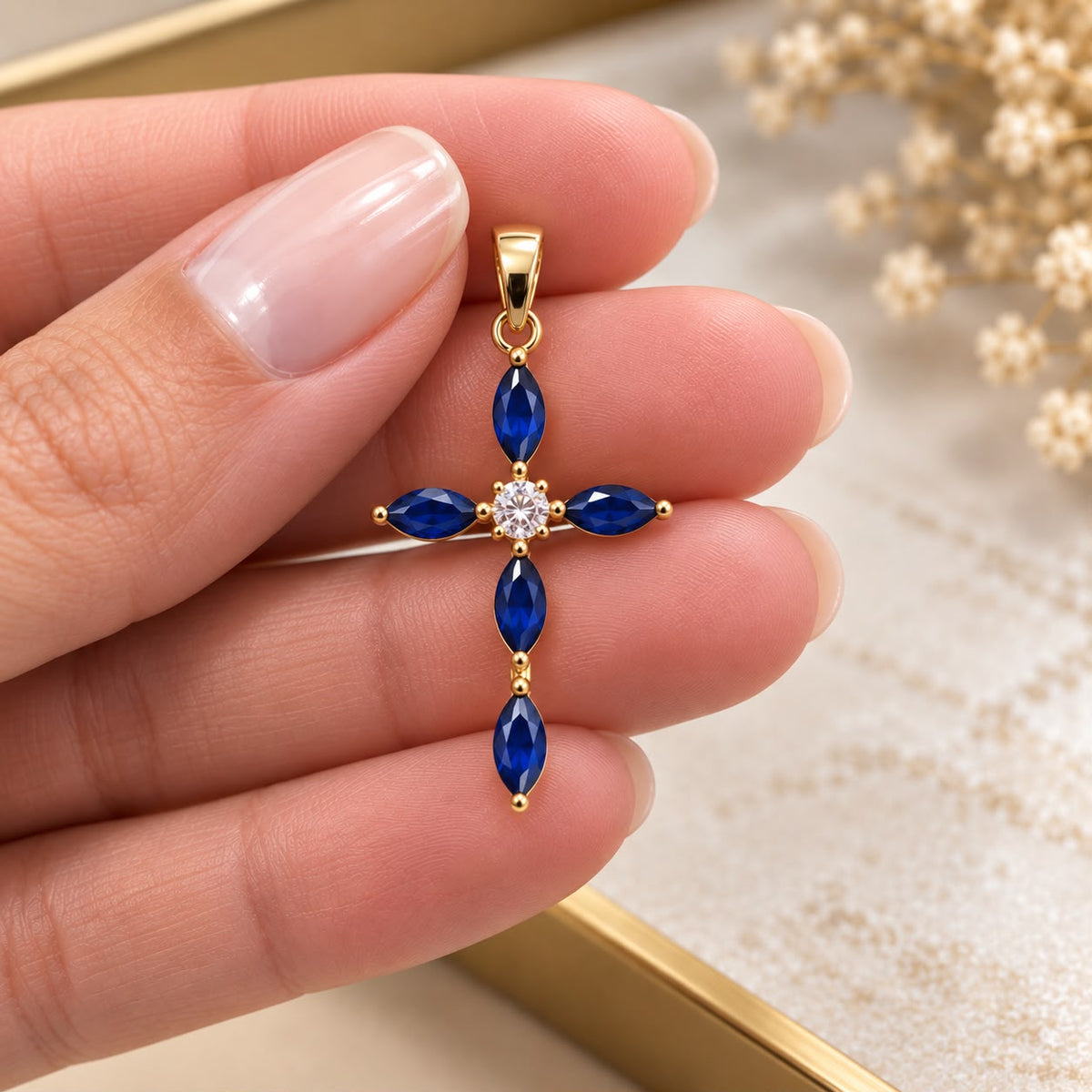 Shop an elegant marquise cross pendant crafted in 18K Gold Filled. Featuring faceted marquise-cut stones and a refined statement design available in multiple color options.