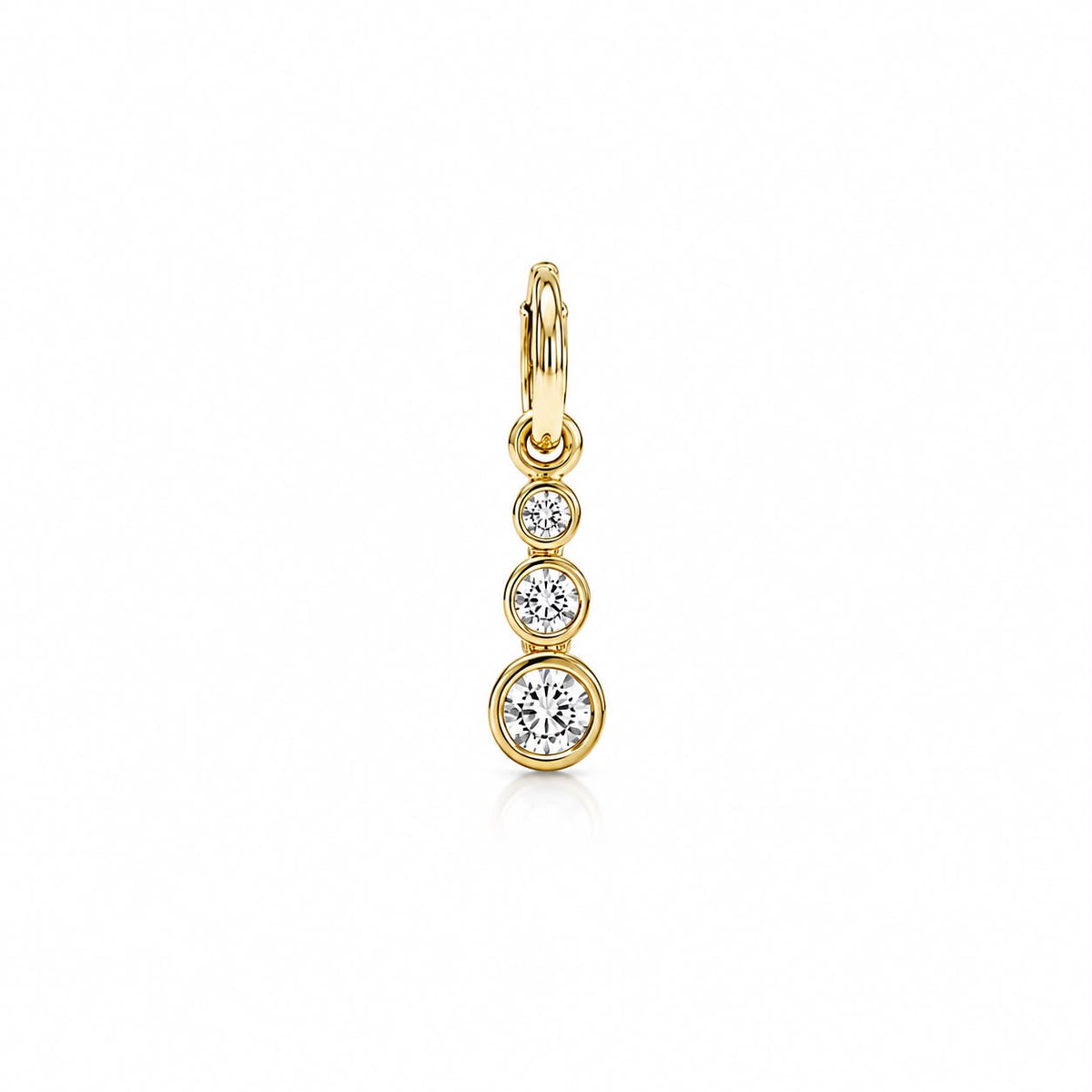 A gold diamond drop earring features three bezel-set stones in a vertical graduation on a plain white background.