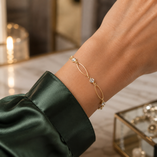 Delicate Gold Filled Bracelet necklace featuring elongated oval links and sparkling cubic zirconia stations. Lightweight, elegant, and perfect for layering.
