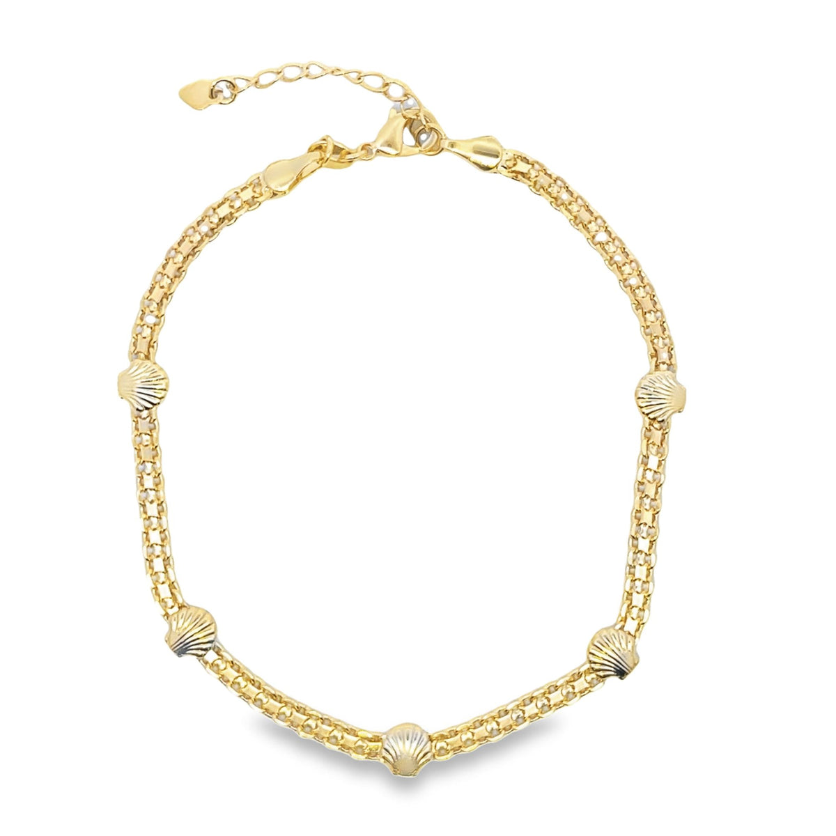 A gold chain necklace features alternating textured links and small seashell charms.