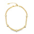 A gold chain necklace features alternating textured links and small seashell charms.