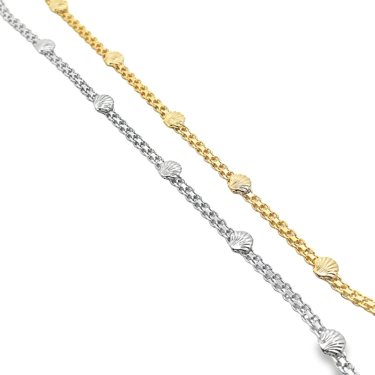 Two delicate gold and silver chain bracelets feature spaced seashell charms against a clean white background.